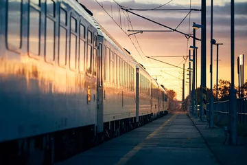 Zelfklevend Fotobehang Train leaving from railroad station © Chalabala