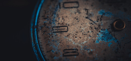 Old dial of a vintage watch. Worn and scratched surface