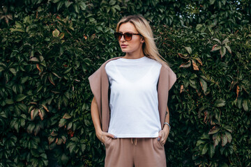 Stylish blonde girl wearing white t-shirt and glasses