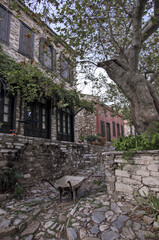 Cobble street and stone houses in a traditional Turkish village