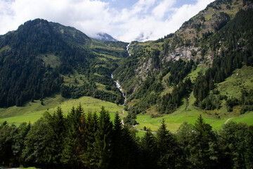 Fototapeta na wymiar Huge waterfall in Ferleiten meanders its way from the top to the valley