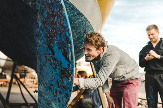 Smiling man checking boat