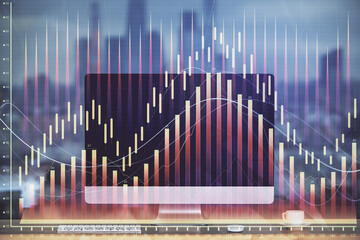 Forex market graph hologram and personal computer on background. Multi exposure. Concept of investment.