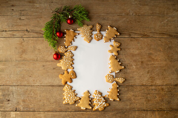 festive frame layout of New Year's christmas gingrerbread cookies on a red background. Merry Christmas and Happy New Year card