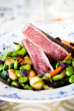 Red meat with vegetables on plate