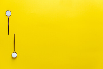 Marine collagen powder in spoons on a yellow background. Dietary supplement. Horizontal orientation, top view, copy space.