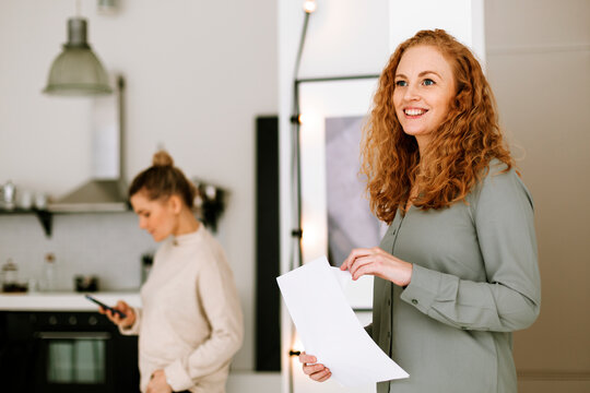 Smiling woman in office kitchen