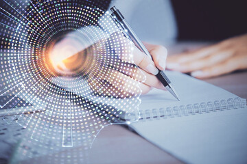 Double exposure of woman's writing hand on background with brain hud. Concept of learning.