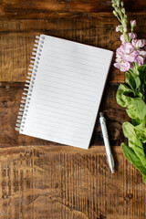 Open notebook on wooden background - 383842666