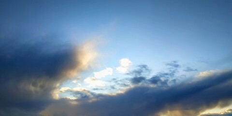 Beautiful blue sky, sun and clouds for background