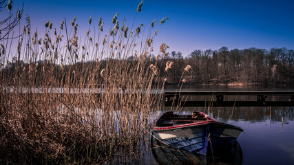 An old wreck of a lake fishing boat, a peaceful place in Poland.