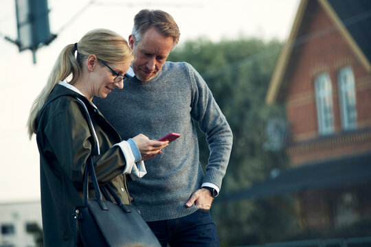 Couple looking at cell phone