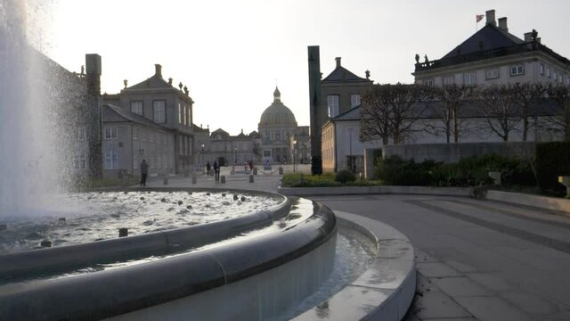 The royal palace in Copenhagen where the queen lives in the city center. Sunny morning and old architecture.