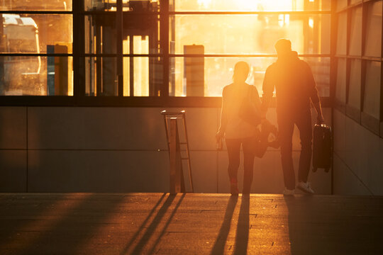 Silhouette of couple walking together