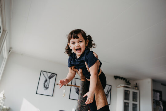 Happy girl hold in air