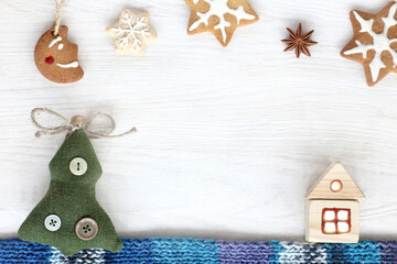 house and tree on a scarf under the moon and stars from the cookie. fabulous winter vacation