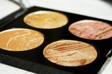 Blush or illuminizer. The concept of fashion and beauty industry. Natural hard light. - Image