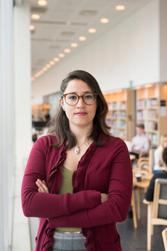 Woman in library looking at camera