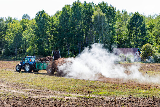 Tractor fertilizing field