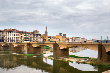 Fototapeta na wymiar Old bridge on the Arno river in Florence.View of the city in Tuscany,Italy
