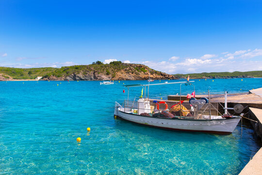 Menorca Es Grau clean port with llaut boats in Balearics