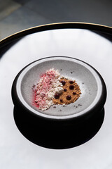 Dessert ice cream with syrup and cocoa powder, close-up