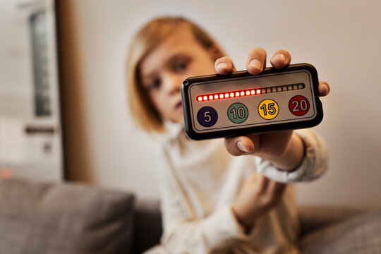 Boy showing electronic game