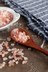 
Pink himalayan salt on rustic background