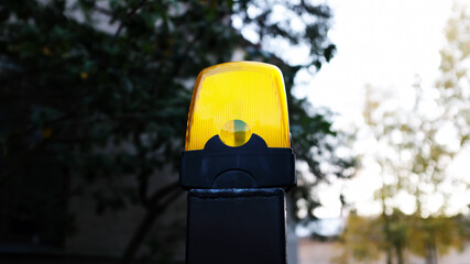 yellow warning light on the gate of the house