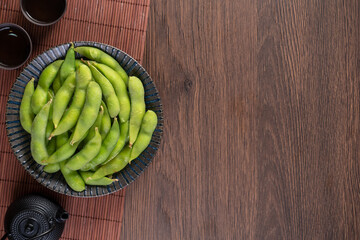 Top view of fresh boiled edamame with copy space.