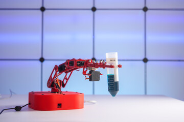 Robot arm with test tube  with biological sample in science laboratory