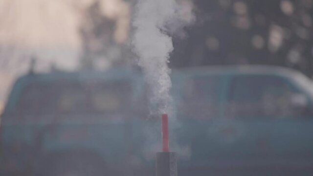 An areal firework fuse burning and explosion or discharge of the firework .