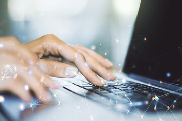 Creative abstract wireless technology hologram and hands typing on computer keyboard on background, artificial intelligence and machine learning concept. Multi exposure