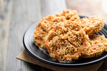 Local Thai snack (Khao Tan Nam Tangmo), Deep fried crispy rice with watermelon juice and cane sugar on top