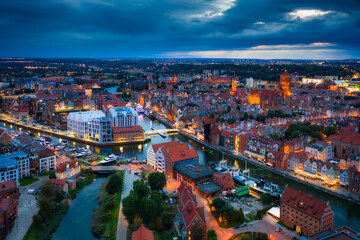 Aerial view of the Gdansk city over Motlawa river with amazing architecture at dusk,  Poland