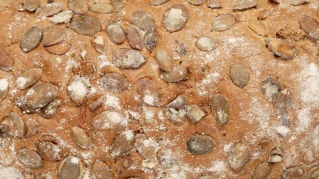 Bread with pumpkin seeds. Bread - background.