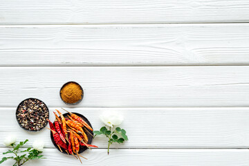Overhead view of hot spice. Red pepper and paprika with cooking utensils