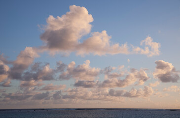 Cumulus Clouds above South Pacific Ocean at Sunset