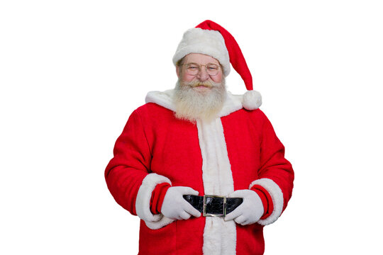 Santa Claus holding his belt. Portrait of authentic Santa Claus with real beard isolated on white background.