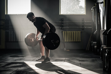 Athletic Male Has Training With Barbell .