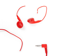 Headphones on a white background. Torn headphones. Repair of electronic devices. Broken wire.