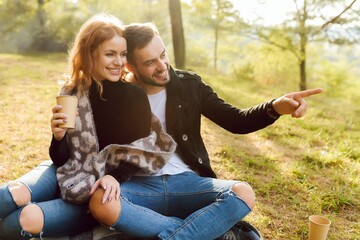 Romantic young couple in love relaxing outdoors in park