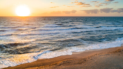 Fototapeta na wymiar Sea waves on the beautiful morning sea