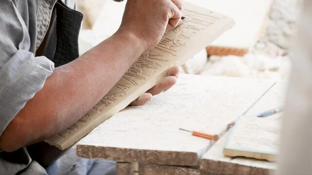 Macro Close Up Shot of Stone Cutter  Process Details. Craftsman Carving Alabaster Slab In Luxor As Part of Performance Of Working Process For Tourists in Egypt
