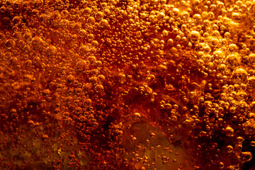 Close up view of the ice cubes in cola background ,Detail of Cold Bubbly Carbonated Soft Drink with...