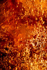 Close up view of the ice cubes in cola background ,Detail of Cold Bubbly Carbonated Soft Drink with...