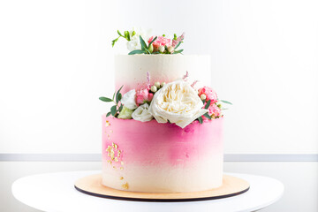 Pink and white wedding bunk cake with fresh flowers decoration