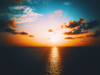 Naklejka na ściany i meble Golden time of sunset in sea.