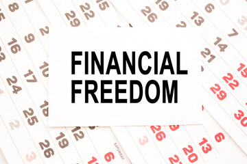 text FINANCIAL FREEDOM on a sheet from Notepad.a digital background. business concept . business and Finance.