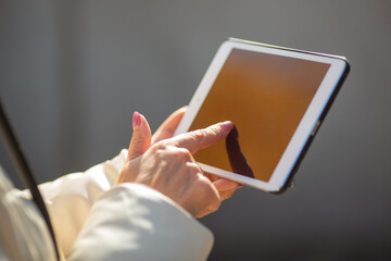 modern tablet in the hands of a woman